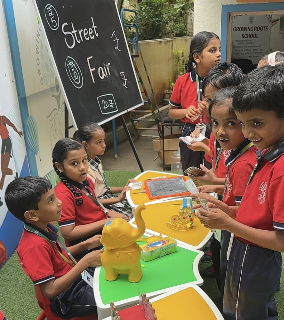 Children roleplaying at classroom street fair